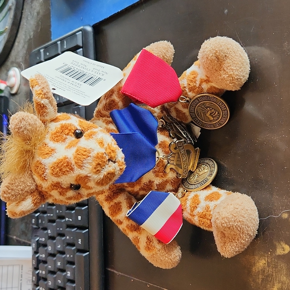 Giraffe plush with Solo and art metals
